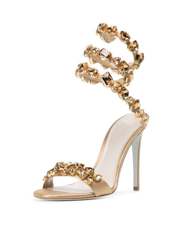Elyra Snake Rhinestone Sandals In Gold